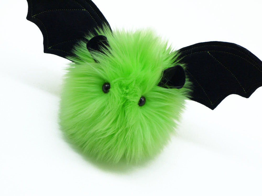 Beetle the lime green bat stuffed animal plush toy angled view.