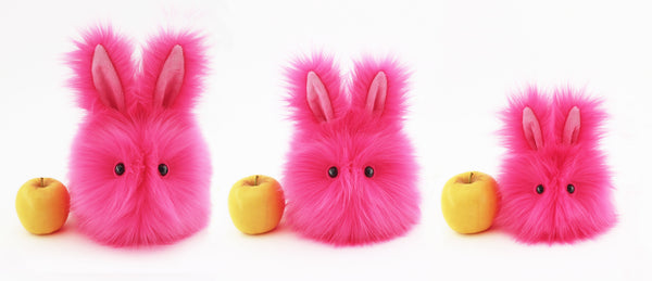 Petunia the Hot Pink Easter bunny plush toy, group shot with apple showing scale..