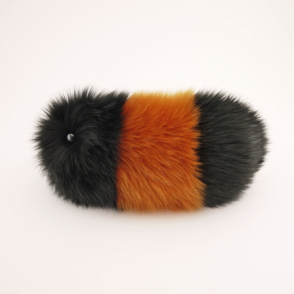 A Wooly Bear caterpillar stuffed animal. At Fuzziggles we call them Snuggle Worms.