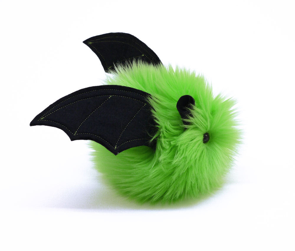 Beetle the lime green bat stuffed animal plush toy side view.