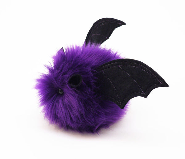 Bella the purple bat stuffed animal plush toy side view.