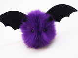Bella the purple bat stuffed animal plush toy angled view.