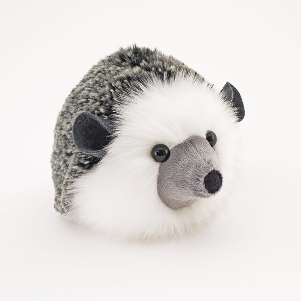 Hemingway the black and grey hedgehog stuffed animal plush toy angled view.