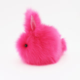 Petunia the Hot Pink Easter bunny plush toy, side view.
