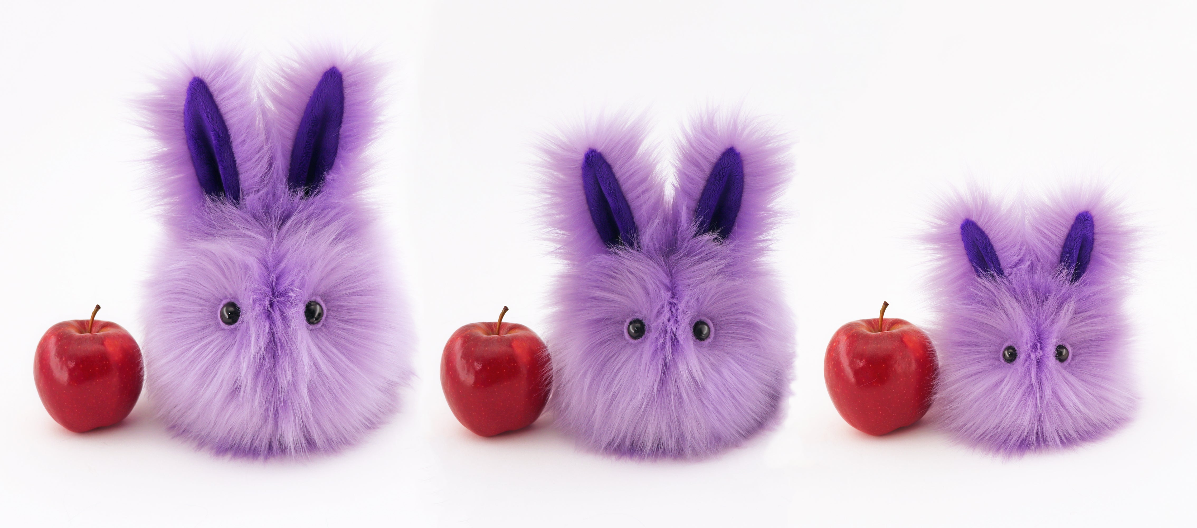 Lavender the Easter bunny plush toy, group view with apple showing scale.