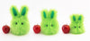 Herb the Easter bunny plush toy, scale view with apples.