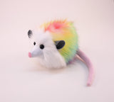 Rainbow Prism Opossum Stuffed Animal Plush Toy side view.